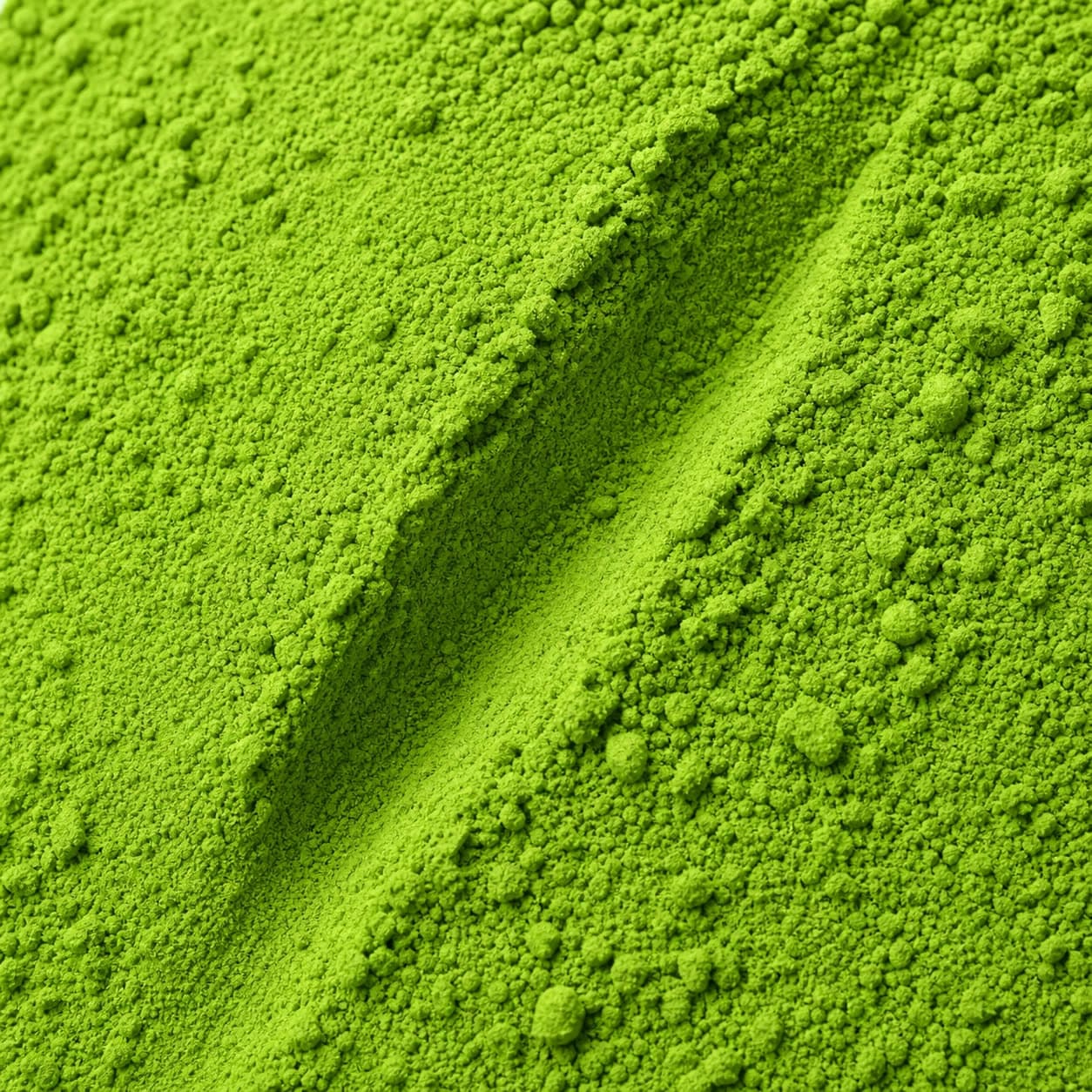 A close-up of fine green Moringa Powder