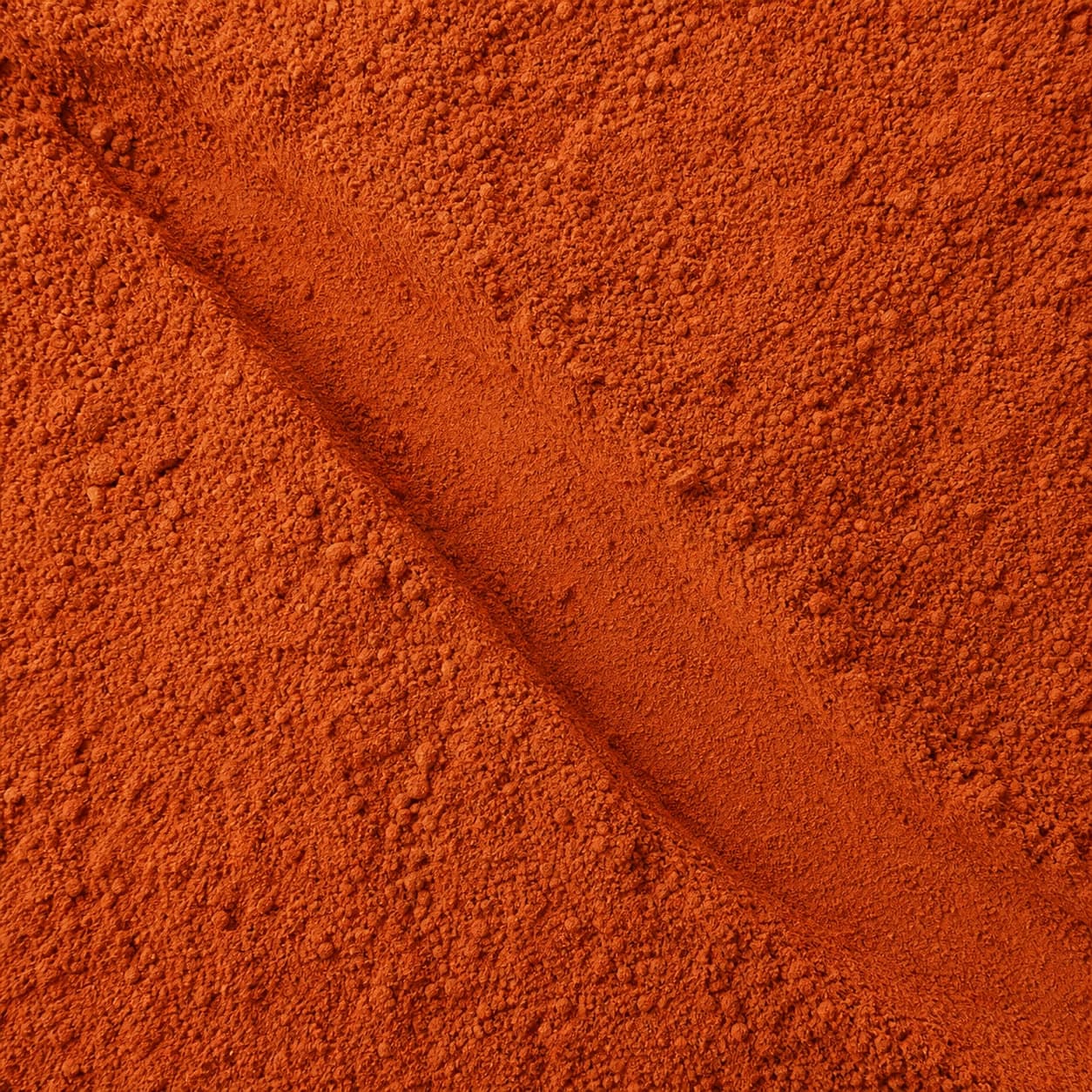 A close-up of fine red Tomato Powder