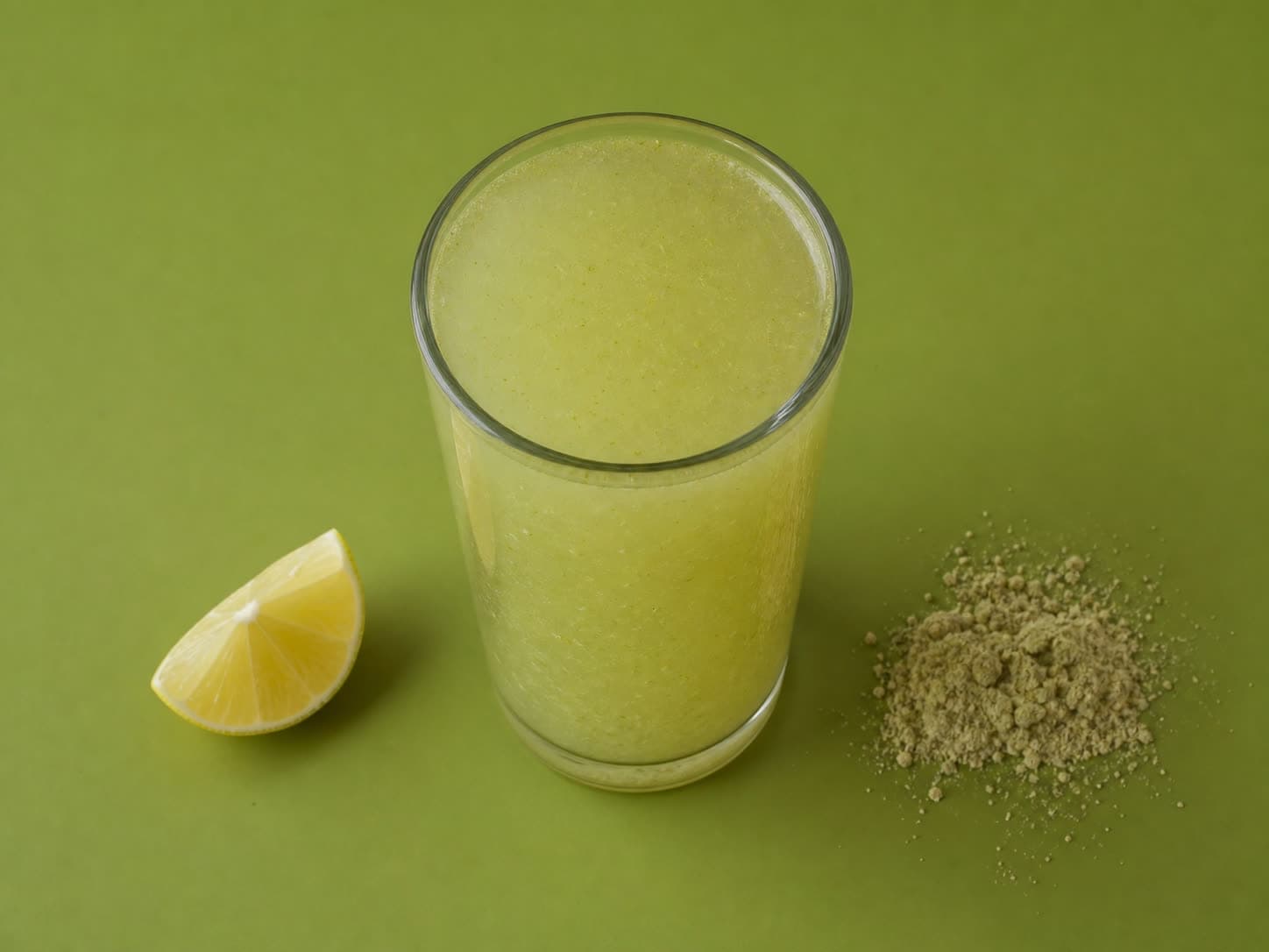 A warm glass of Amla Immunity Shot with lemon and honey